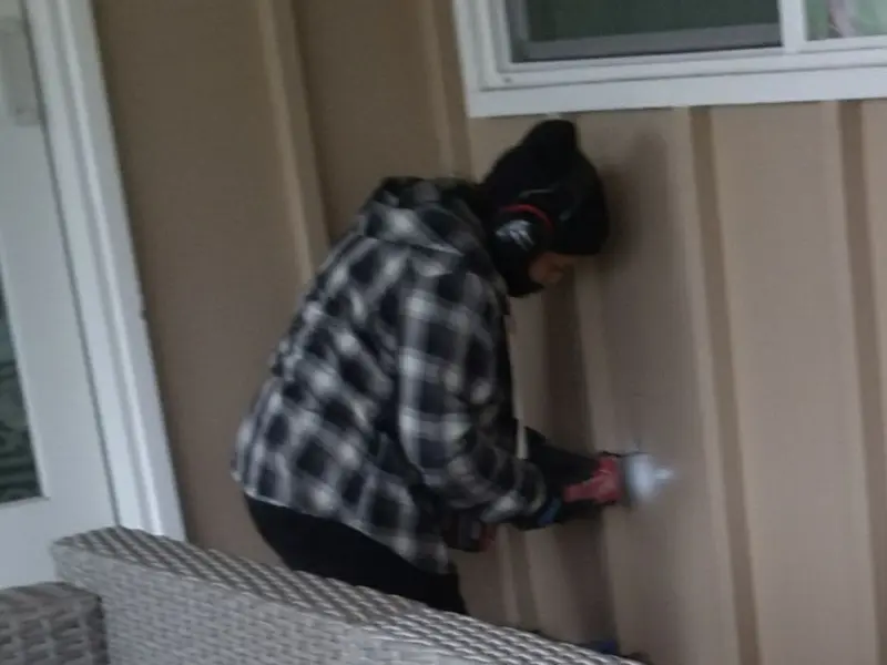 Professional electrician installing an exterior outlet in Somerset