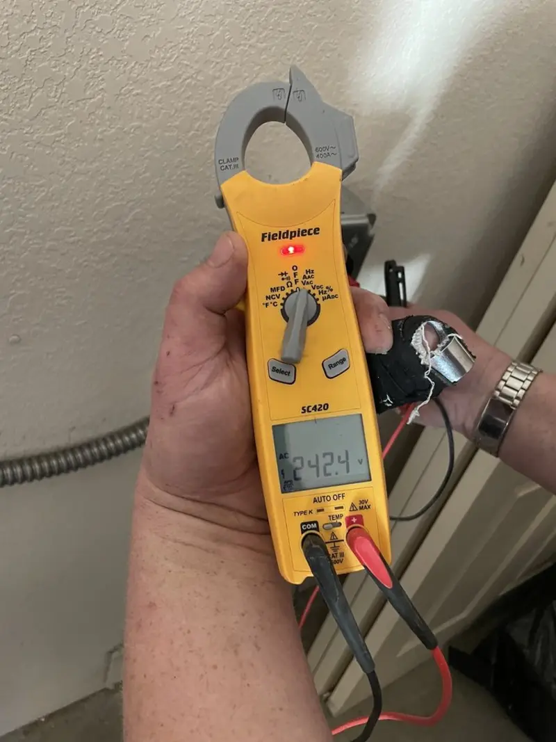 Voltage testing with clamp meter during Recessed Lighting Installation in Somerset